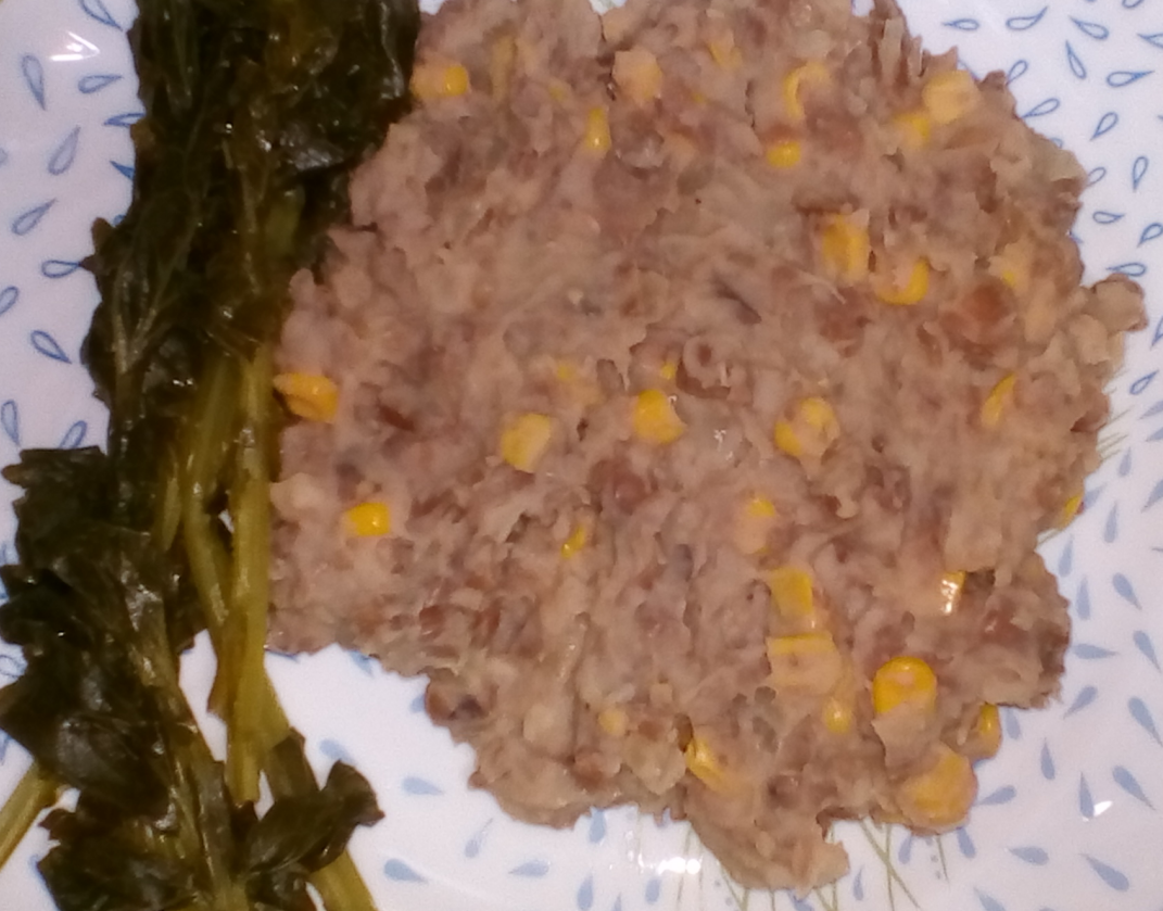 Dish with refried beans and corn.